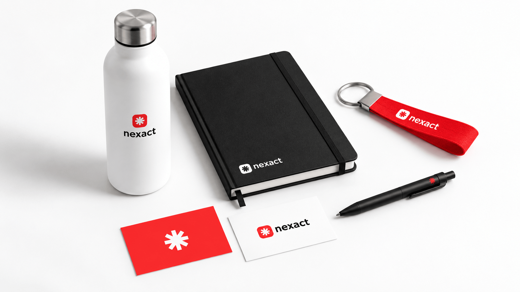 Photograph of NEXACT stationery: a proposal folder and two business cards on a white surface.